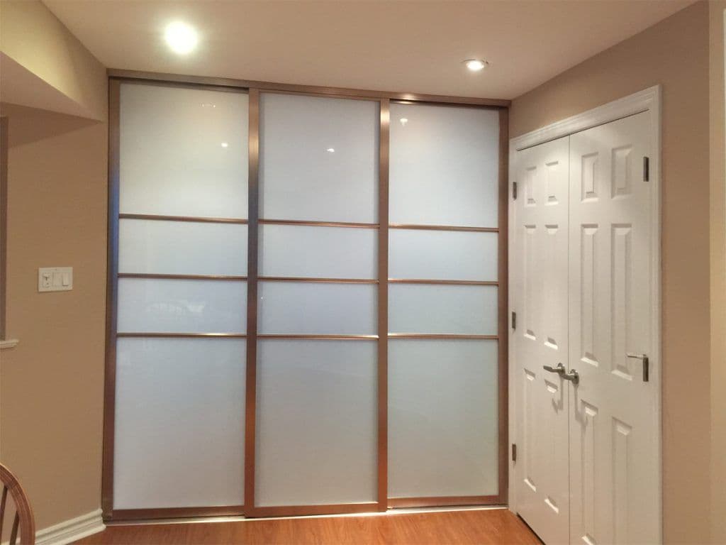 Completed Roomidea sliding glass divider creating an interior room boundary