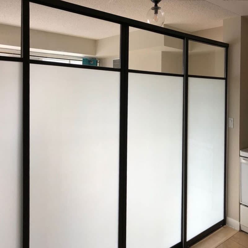 Completed Roomidea black-framed sliding doors with frosted panels