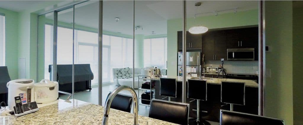 Completed Roomidea glass divider between kitchen and living spaces