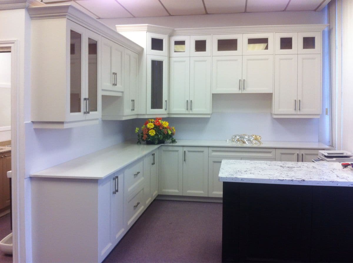 Completed Roomidea light-toned kitchen cabinetry with upper and lower storage