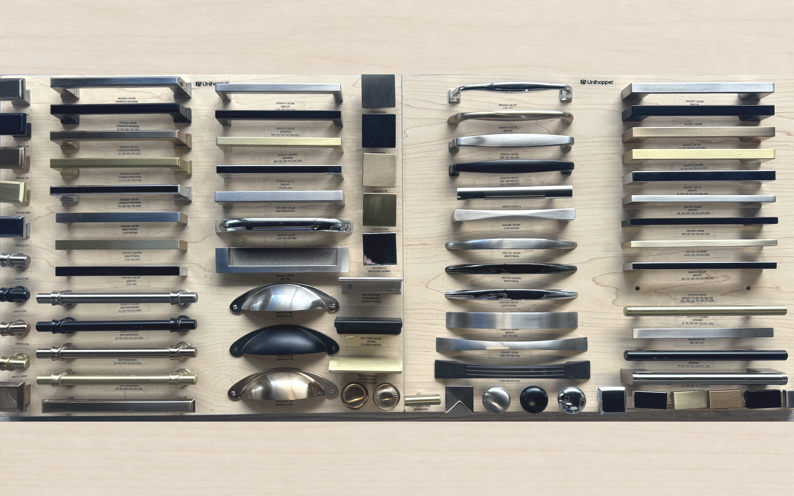 Showroom display of cabinet handles, pulls and knobs in varied shapes and metal finishes