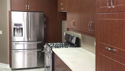 Completed Roomidea modern kitchen with fitted upper and lower cabinets