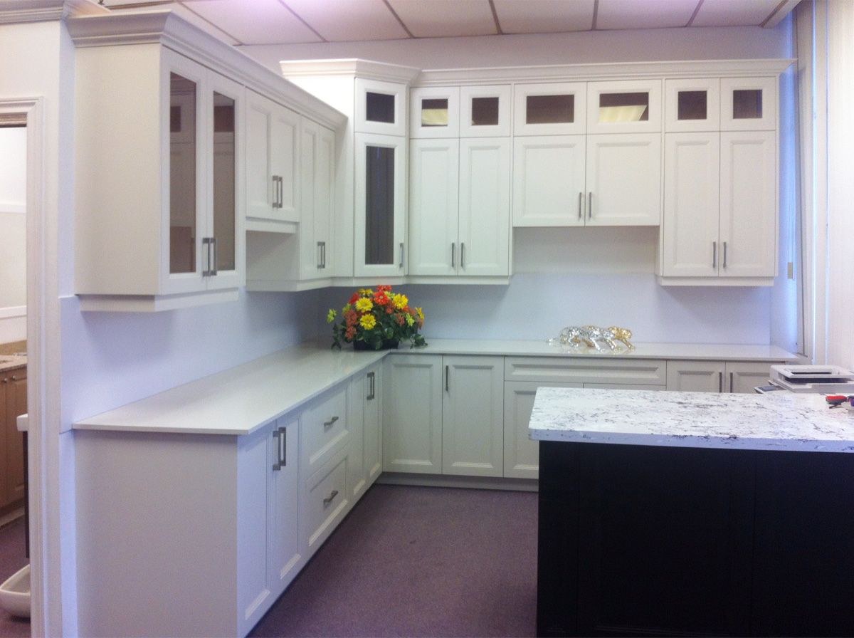 Completed Roomidea light-toned kitchen cabinetry with fitted storage