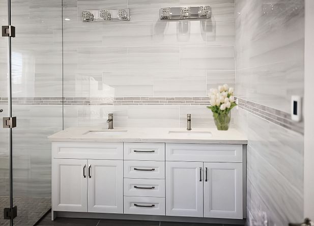 Completed Roomidea bathroom vanity with drawers, cabinet doors, and a stone countertop