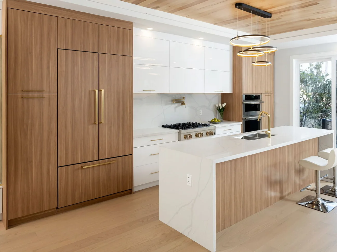 Completed Modern kitchen with warm wood and high-gloss white flat-panel cabinetry.