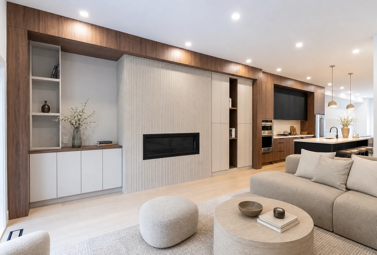 Coordinated renovation project with an integrated media wall, fireplace, display storage, and kitchen cabinetry